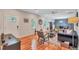 Open-concept living room with hardwood floors, modern furnishings, and lots of natural light at 2418 Bolling Brook Sw Dr, Atlanta, GA 30311