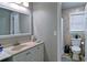 Clean bathroom featuring a shower, window and a spacious single vanity at 2420 Westport Cir, Marietta, GA 30064