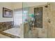 Bathroom featuring a luxurious jacuzzi tub and a walk-in shower with marble tile at 2420 Westport Cir, Marietta, GA 30064