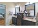 Dual vanities with granite countertops and dark wood cabinets in spacious bathroom at 2420 Westport Cir, Marietta, GA 30064
