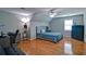 Large bedroom featuring a ceiling fan, hardwood floors and a neutral color palette at 2420 Westport Cir, Marietta, GA 30064