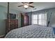 Comfortable bedroom featuring a four-poster bed, ceiling fan, and ample natural light at 2420 Westport Cir, Marietta, GA 30064