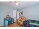 Bright bedroom featuring hardwood floors, a ceiling fan, and neutral decor at 2420 Westport Cir, Marietta, GA 30064