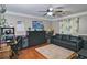 Cozy bedroom with hardwood floors, ceiling fan, and ample space for furniture and relaxation at 2420 Westport Cir, Marietta, GA 30064