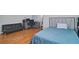 Bedroom featuring hardwood floors, work space, and a comfortable full-sized bed at 2420 Westport Cir, Marietta, GA 30064