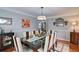 Elegant dining room featuring hardwood floors, stylish lighting, and a large dining table at 2420 Westport Cir, Marietta, GA 30064