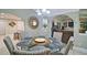 Open dining room with glass table and views of the living areas at 2420 Westport Cir, Marietta, GA 30064