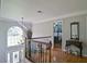 Light-filled entry foyer featuring a chandelier and views into other rooms at 2420 Westport Cir, Marietta, GA 30064