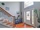 Bright foyer featuring hardwood floors, a staircase with rod iron spindles, and a high ceiling at 2420 Westport Cir, Marietta, GA 30064