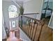 Elegant foyer overlooking the front door, with hardwood floors, stairs, and a bedroom door opening off the landing at 2420 Westport Cir, Marietta, GA 30064