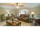 Inviting living room with modern ceiling fan and comfortable leather sofa at 2420 Westport Cir, Marietta, GA 30064