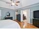 Bright main bedroom with hardwood floors featuring an ensuite bathroom and walk in closet at 2420 Westport Cir, Marietta, GA 30064