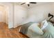 Bright bedroom with hardwood floors, ceiling fan, and a window with blinds at 429 Deckner Sw Ave, Atlanta, GA 30310