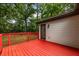 Exterior shows a large, red-painted deck, perfect for entertaining, extending the home's outdoor living space at 429 Deckner Sw Ave, Atlanta, GA 30310