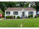 A charming home boasts a freshly mowed lawn and well-manicured landscaping at 429 Deckner Sw Ave, Atlanta, GA 30310