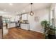 A clean and bright kitchen featuring stainless steel appliances, white cabinets and black countertops at 429 Deckner Sw Ave, Atlanta, GA 30310