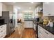 Modern kitchen featuring white cabinets, stainless steel appliances, and an open layout at 429 Deckner Sw Ave, Atlanta, GA 30310