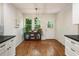Bright kitchen nook featuring lots of natural light, white walls, and wood flooring at 429 Deckner Sw Ave, Atlanta, GA 30310