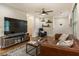 Well-lit living room featuring hardwood floors, stylish decor, and a comfortable leather sofa at 429 Deckner Sw Ave, Atlanta, GA 30310