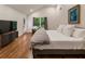 Bright main bedroom with hardwood floors, ensuite bathroom, and large windows providing ample natural light at 429 Deckner Sw Ave, Atlanta, GA 30310