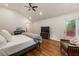 Vaulted ceiling bedroom with hardwood floors, ceiling fan, balcony access, and an open layout at 429 Deckner Sw Ave, Atlanta, GA 30310