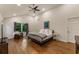 Bright, spacious main bedroom featuring vaulted ceiling, fan, and hardwood flooring at 429 Deckner Sw Ave, Atlanta, GA 30310