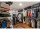 Spacious walk-in closet with custom shelving, ample storage, and hardwood floors at 429 Deckner Sw Ave, Atlanta, GA 30310