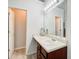 Bathroom with a single sink vanity and a large mirror at 468 Berkshire Place, Fairburn, GA 30213