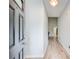 Welcoming entryway with light gray walls and wood-look floors, leading to the main living area at 468 Berkshire Place, Fairburn, GA 30213
