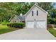 Charming home with a two-car garage, stone facade, manicured lawn, and lovely curb appeal at 468 Berkshire Place, Fairburn, GA 30213