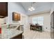 Bright eat-in kitchen featuring granite counters, stainless steel appliances, and recessed lighting at 468 Berkshire Place, Fairburn, GA 30213