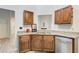 Kitchen with granite countertops, stainless steel appliances, and wood cabinetry at 468 Berkshire Place, Fairburn, GA 30213