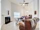 Spacious living room with a vaulted ceiling, a fireplace and a view to the dining area at 468 Berkshire Place, Fairburn, GA 30213