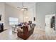 Beautiful living room with vaulted ceilings, fireplace, wood-look flooring, and natural light at 468 Berkshire Place, Fairburn, GA 30213