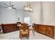 Open concept living and dining area with vaulted ceilings and wood-look floors, great for gatherings at 468 Berkshire Place, Fairburn, GA 30213