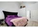Primary bedroom boasts wood flooring, high ceilings, and a comfortable king-sized bed at 468 Berkshire Place, Fairburn, GA 30213