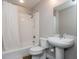 Clean bathroom featuring a shower-tub combination with white tiling and a pedestal sink at 845 Spring Street Northwest Nw St # 307, Atlanta, GA 30308