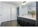 Bright bathroom with dual sinks, modern finishes, and a walk-in shower behind glass enclosure at 845 Spring Street Northwest Nw St # 307, Atlanta, GA 30308