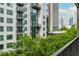 Exterior view showcasing the building's architecture and surrounding green landscape at 845 Spring Street Northwest Nw St # 307, Atlanta, GA 30308