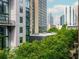 Exterior view showcasing the building's architecture and surrounding green landscape at 845 Spring Street Northwest Nw St # 307, Atlanta, GA 30308