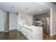 A modern kitchen features a white marble-look island with pendant lighting and stainless steel appliances at 845 Spring Street Northwest Nw St # 307, Atlanta, GA 30308