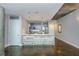Bright kitchen features unique wood paneling on the island and concrete ceilings at 845 Spring Street Northwest Nw St # 307, Atlanta, GA 30308