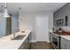 Modern kitchen featuring stainless steel appliances, marble countertops, and stylish lighting at 845 Spring Street Northwest Nw St # 307, Atlanta, GA 30308