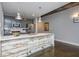 Kitchen features modern appliances and fixtures with unique wood paneling on the island at 845 Spring Street Northwest Nw St # 307, Atlanta, GA 30308