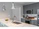 Bright kitchen featuring stainless steel appliances, marble countertops, and stylish lighting at 845 Spring Street Northwest Nw St # 307, Atlanta, GA 30308