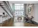 Spacious living room with high ceilings, large windows and metal staircase at 845 Spring Street Northwest Nw St # 307, Atlanta, GA 30308