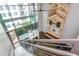A view from the staircase down into the living room with modern styling and decor at 845 Spring Street Northwest Nw St # 307, Atlanta, GA 30308