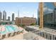 Rooftop pool with lounge chairs, surrounded by city views and modern architecture at 845 Spring Street Northwest Nw St # 307, Atlanta, GA 30308