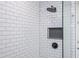 Modern shower with subway tile surround, niche, glass door, and matte black fixtures at 845 Spring Street Northwest Nw St # 307, Atlanta, GA 30308