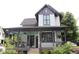 Charming home featuring a spacious covered front porch with beautiful views of the landscaped yard at 1907 Galt, Kennesaw, GA 30144